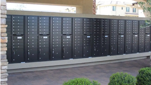Florence 1570-16 Cluster Box Units installed outside a modern apartment complex - Select Commercial Mailboxes